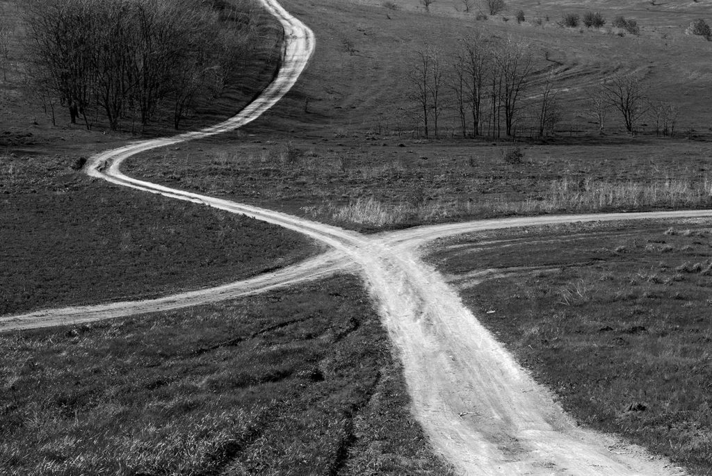 a crossroads in a field