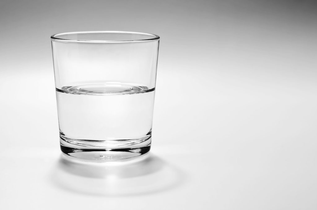 a glass half full, or empty, with water