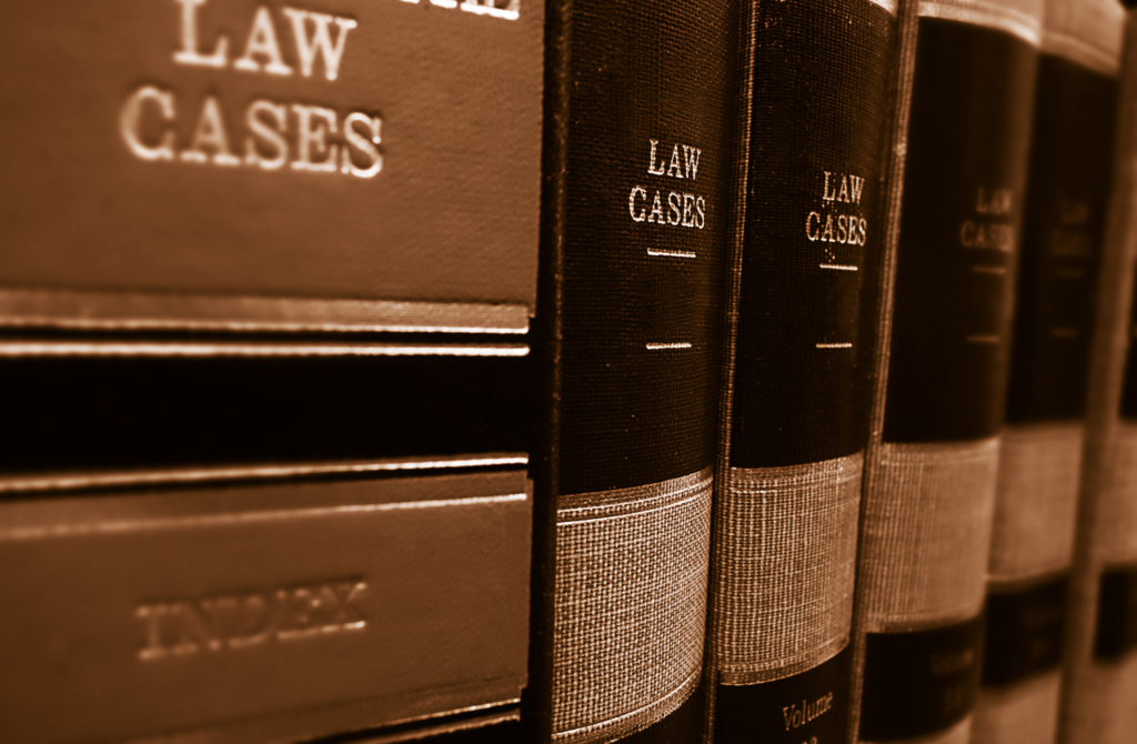 a row of books of law cases on a shelf