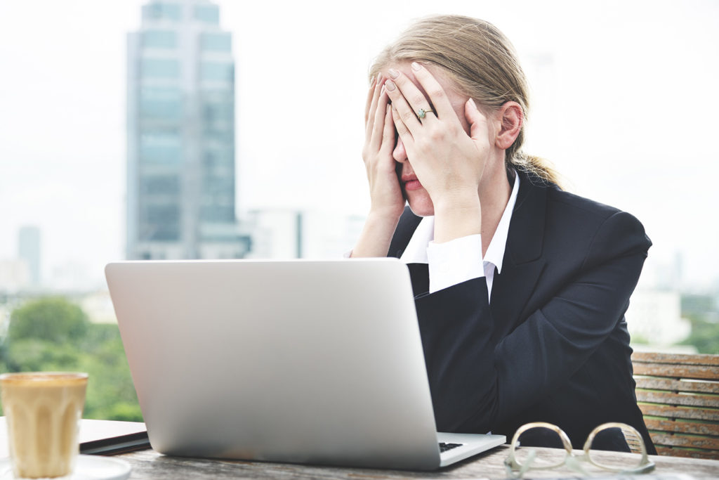 lawyer holding hands over eyes in exhasperation