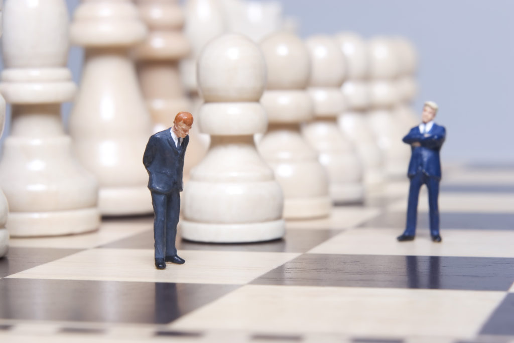 1:150 scale figures of two layers on a full-sized chessboard