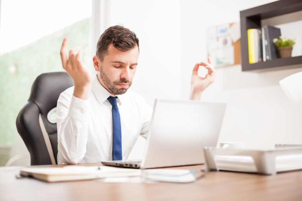 lawyer meditating at desk