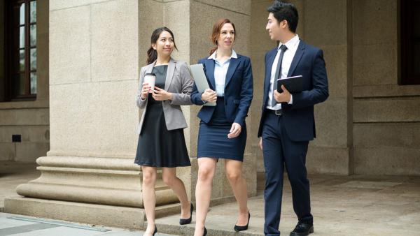 three amicable attorneys leaving the courthouse together