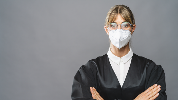 judge wearing a surgical mask