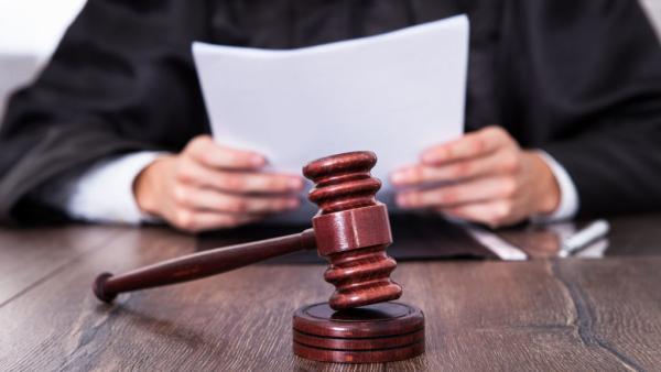 judge reviewing a document