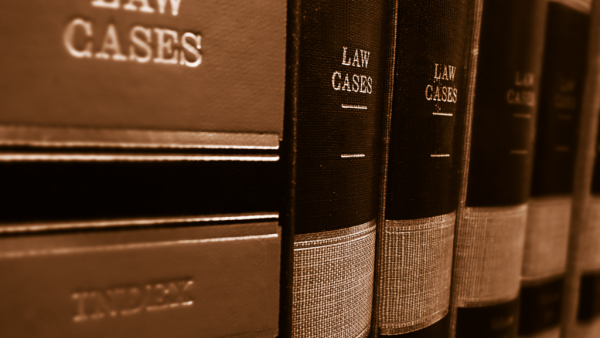 a row of books of law cases on a shelf