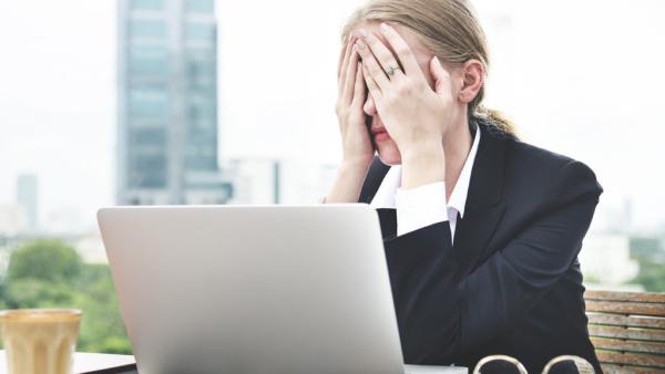 lawyer holding hands over eyes in exhasperation