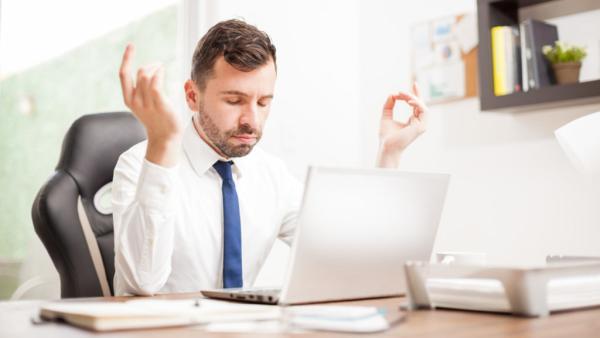 lawyer meditating at desk