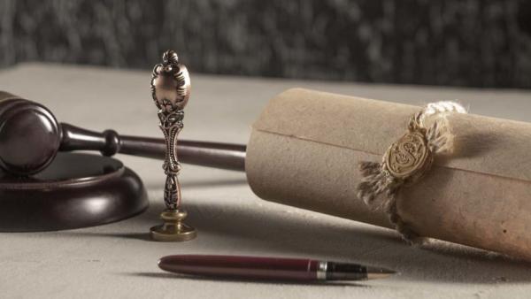 old legal scroll and gavel