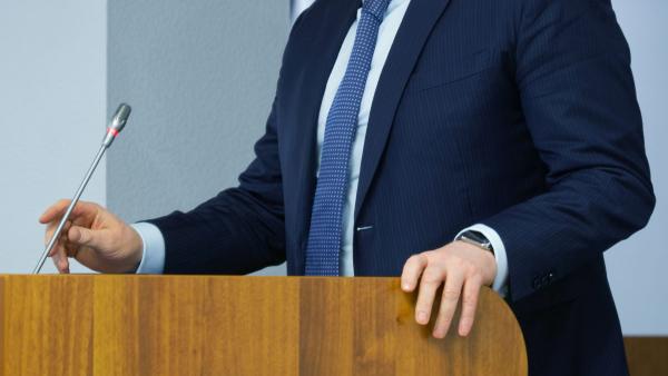 lawyer standing at a podium