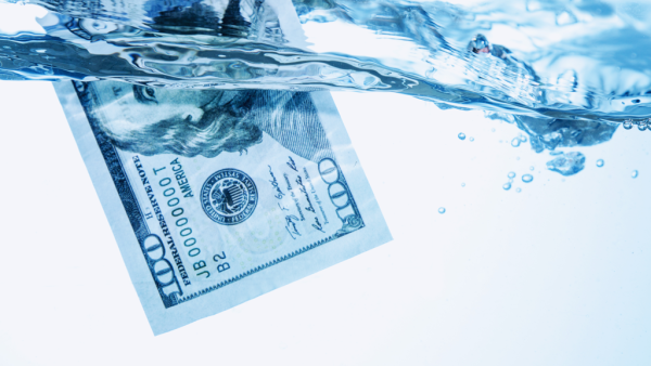 $100 bill floating in water